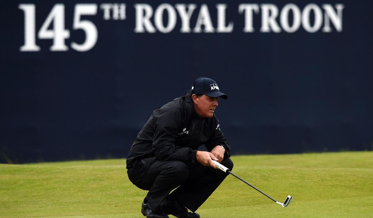 Phil Mickelson lines up a putt on the 18th green during the second round of the British Open at Royal Troon in Scotland on Friday.