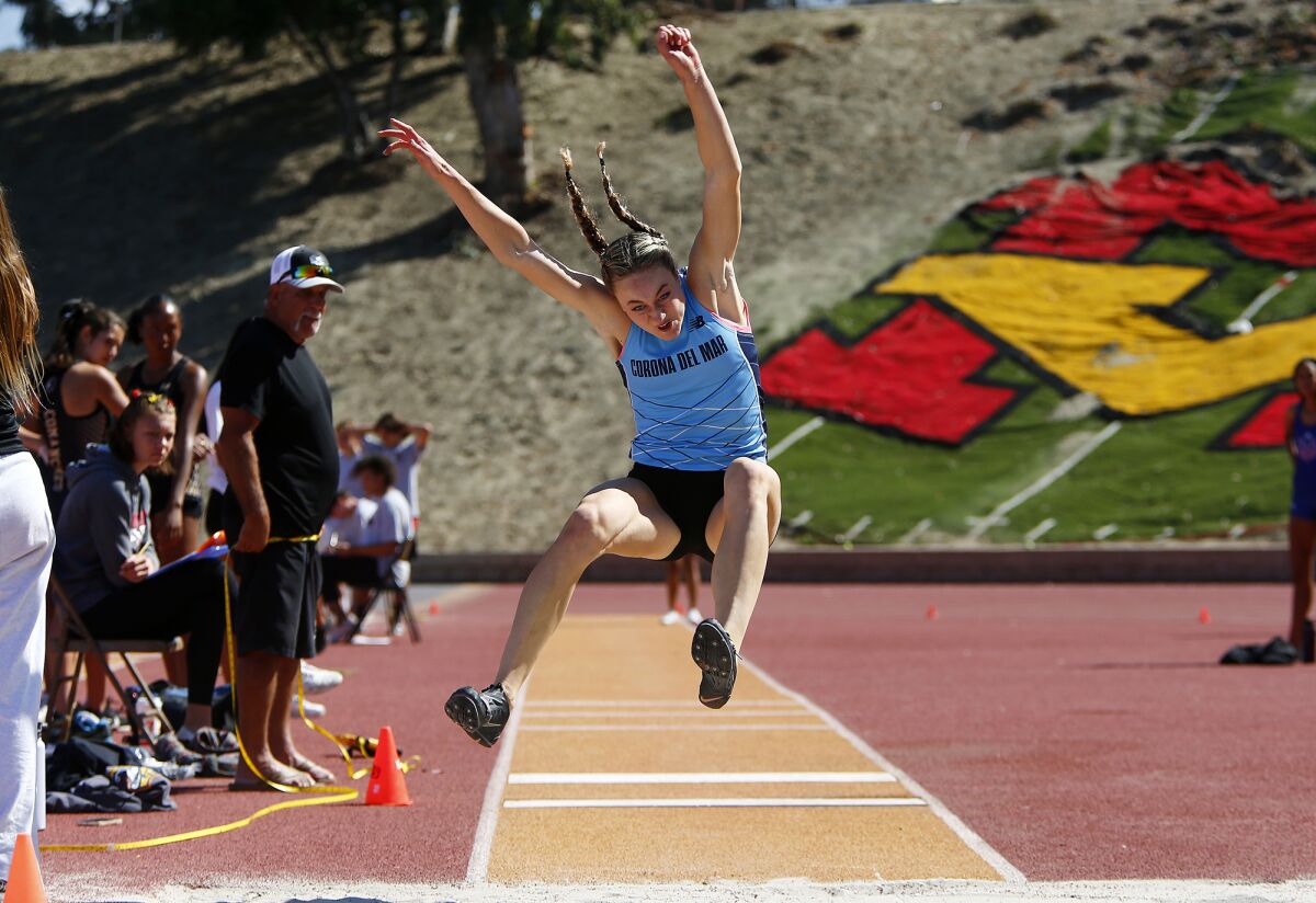 Corona del Mar's Caroline Glessing competes in the girls' long jump in the Orange County track and field championships.