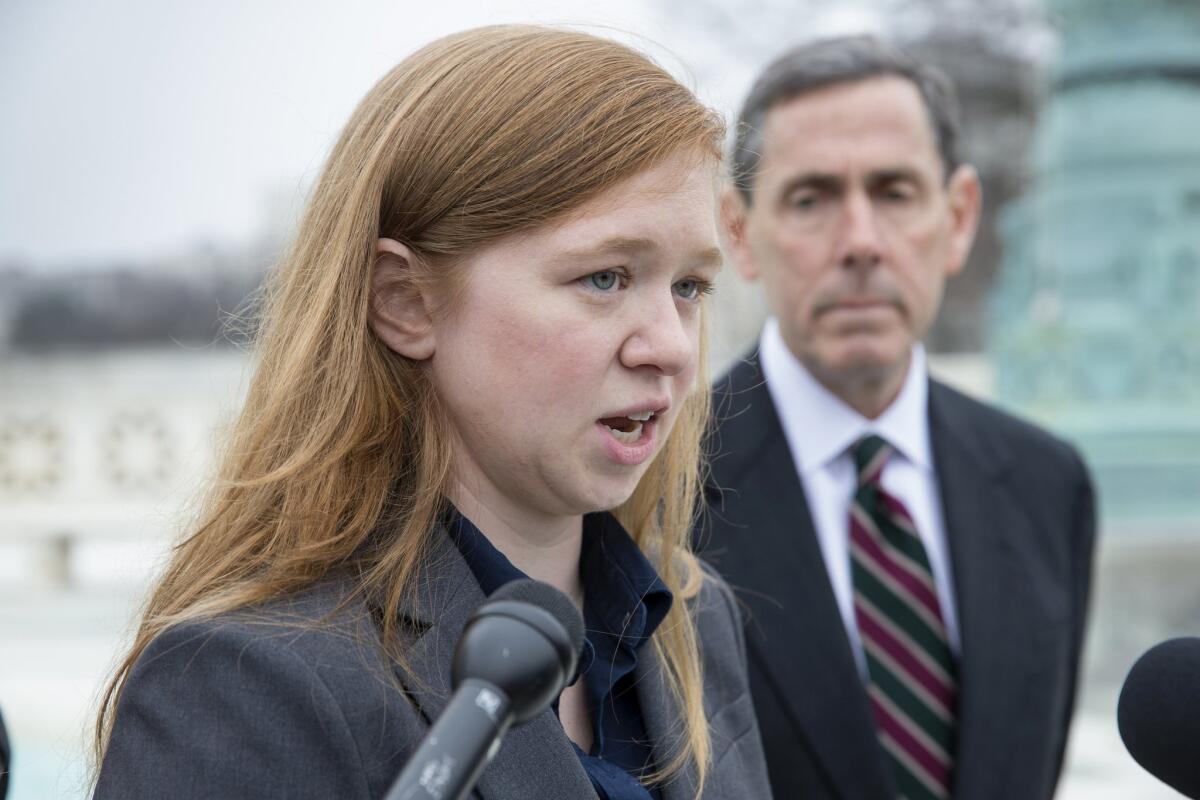 Abigail Fisher, who challenged the use of race in college admissions, is joined by Edward Blum outside the Supreme Court this month.