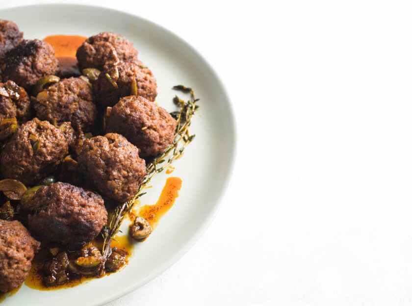 This image released by Milk Street shows a recipe for Spanish Meatballs. (Milk Street via AP)