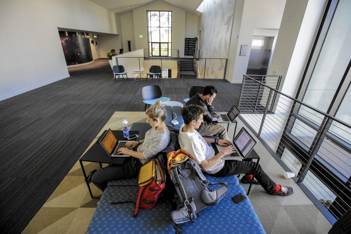 Eliza Burke, left, Peter Atkin and Elliot Warner study for their final exams at Pomona College in Claremont.