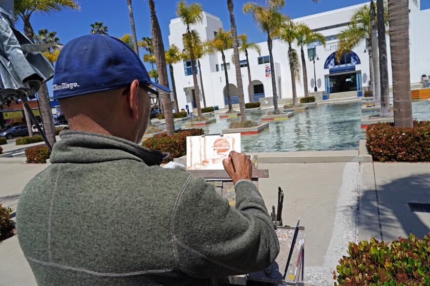Artist Danny Griego painting in Oceanside.