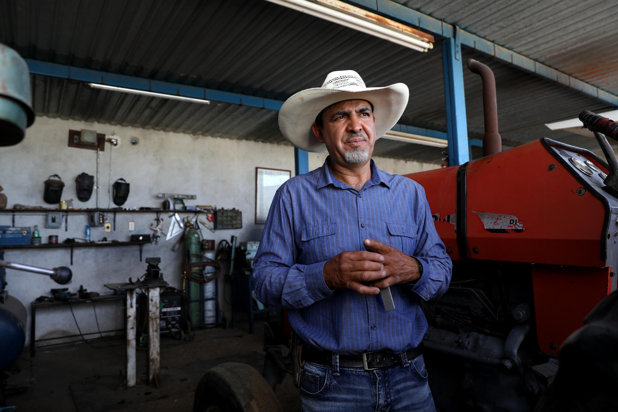 Benjamin Carrillo, 43, wears a cowboy hat at his home in Zacatecas.
