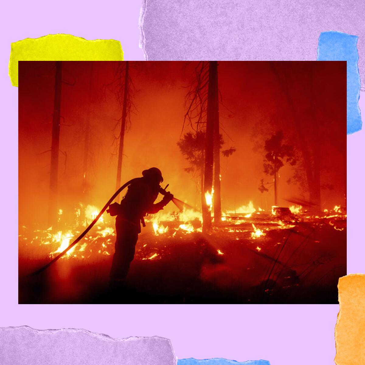 A firefighter in silhouette with burning ground and orange haze at night.