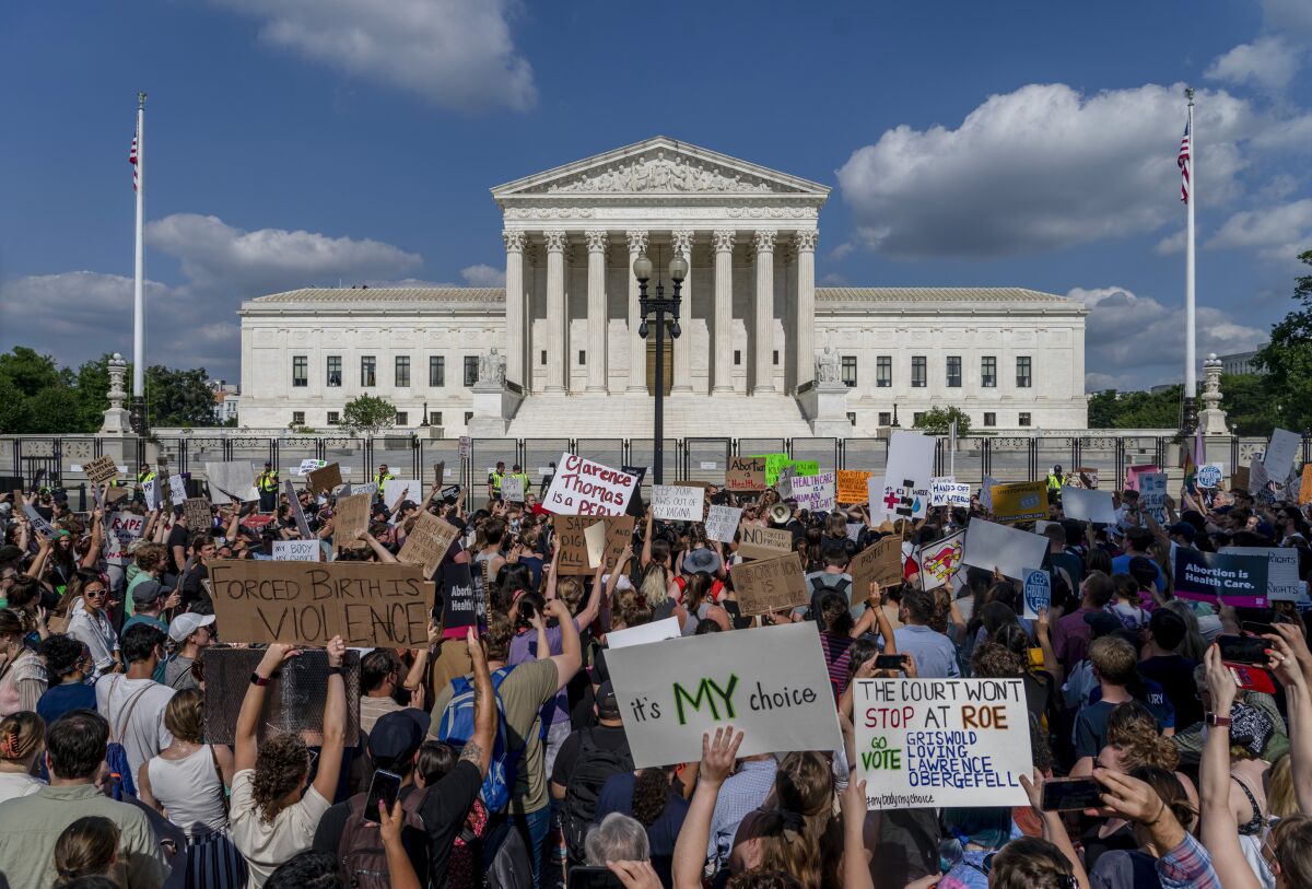 Abortion-rights and anti-abortion demonstrators gather outside of the Supreme Court in Washington, Friday, June 24, 2022. 