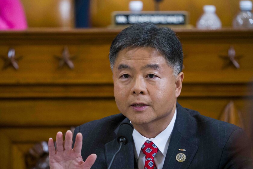 Rep. Ted Lieu speaks into a microphone during a House hearing.