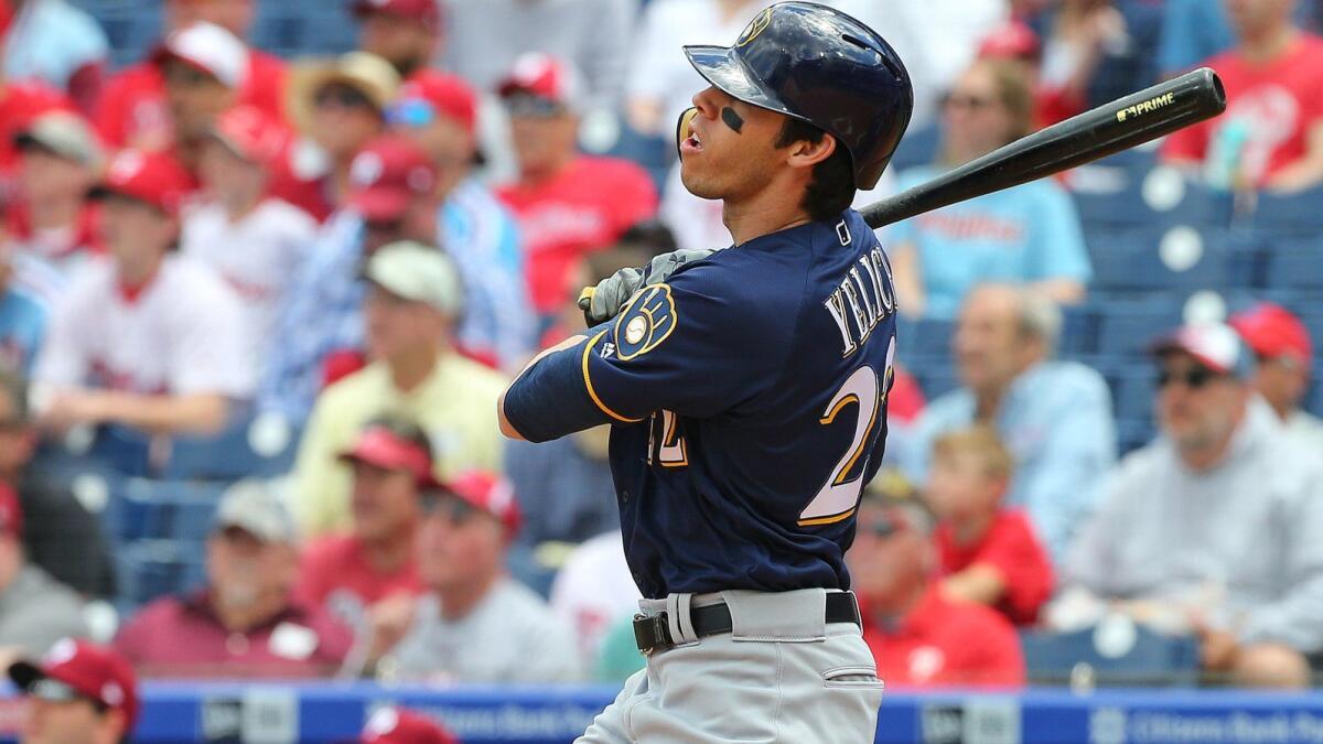 Christian Yelich watches his home run during the first inning Thursday.