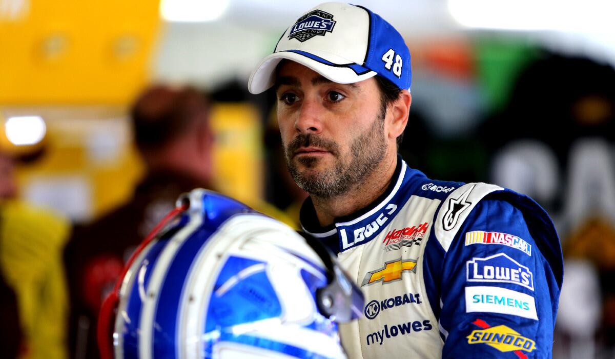 Jimmie Johnson stands in the garage during an Aug. 2 practice for the NASCAR Sprint Cup Series GoBowling.com 400 at Pocono Raceway in Long Pond, Pa.