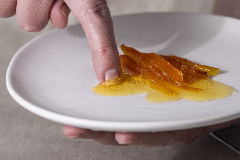 LOS ANGELES, CALIFORNIA, Jan. 19, 2022: Step-by-step citrus marmalade-cooking guide: checking the texture of cooked Seville-oranges marmalade agaist a frozen plate for the January "LA in A Jar" story by Ben Mims, photographed on Wednesday, January 18, 2022, at Proplink Studios in the Arts District in Downtown Los Angeles. (Silvia Razgova / For The Times, Prop Styling / Jennifer Sacks, Photo Assistant / Olliver Leighton)