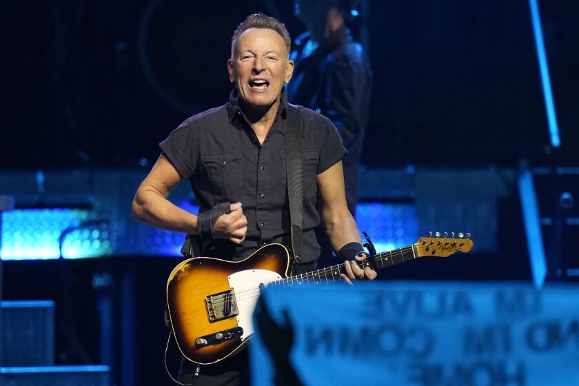 FILE - Singer Bruce Springsteen and the E Street Band perform during their 2023 tour Feb. 1, 2023, at Amalie Arena in Tampa, Fla. President Joe Biden will award Springsteen with the 2021 National Medal of Arts on March 21, 2023. (AP Photo/Chris O'Meara, File)