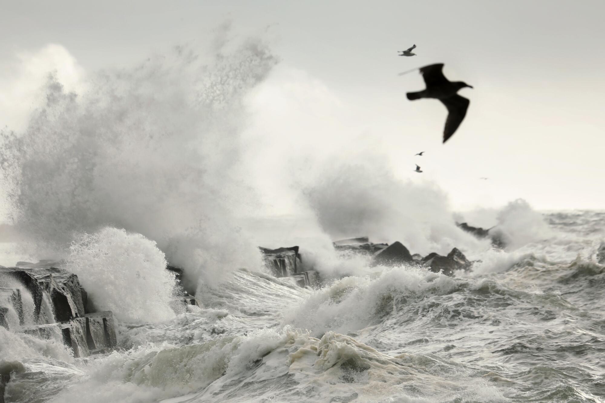 Storm surges pound the sea wall at Cabrillo Beach in San Pedro Tuesday morning.