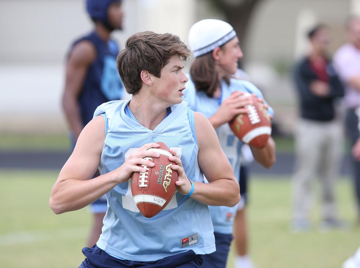 Quarterback Ethan Garbers throws a pass during a spring football showcase at Corona del Mar High on Wednesday.