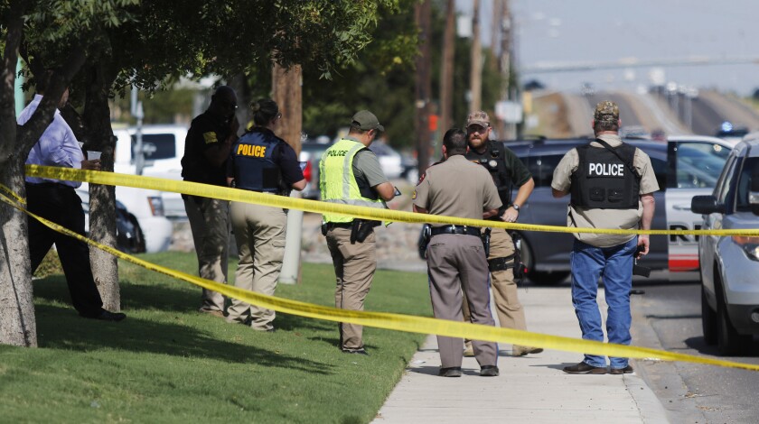 Authorities cordon off a portion of 42nd Street in Odessa, Texas, where some of the shootings occurred.