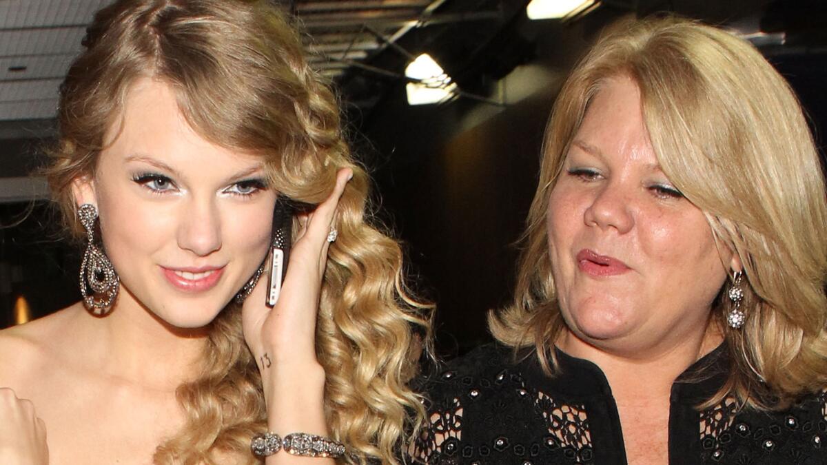 Taylor Swift, left, and her mom, Andrea Swift, backstage at the Grammy Awards in 2010. On April 9, the singer announced that her mom has been diagnosed with cancer.