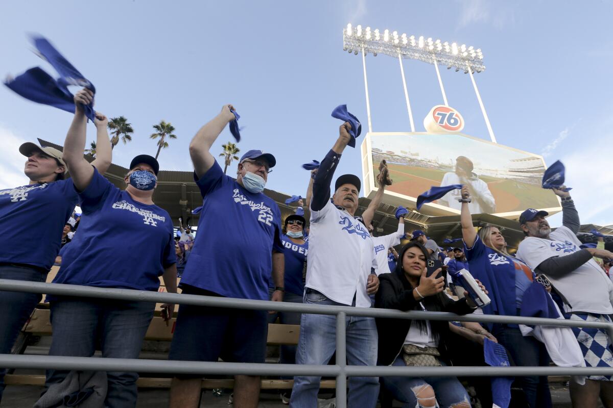 Dodgers fans wave their towels in the outfield pavilion.