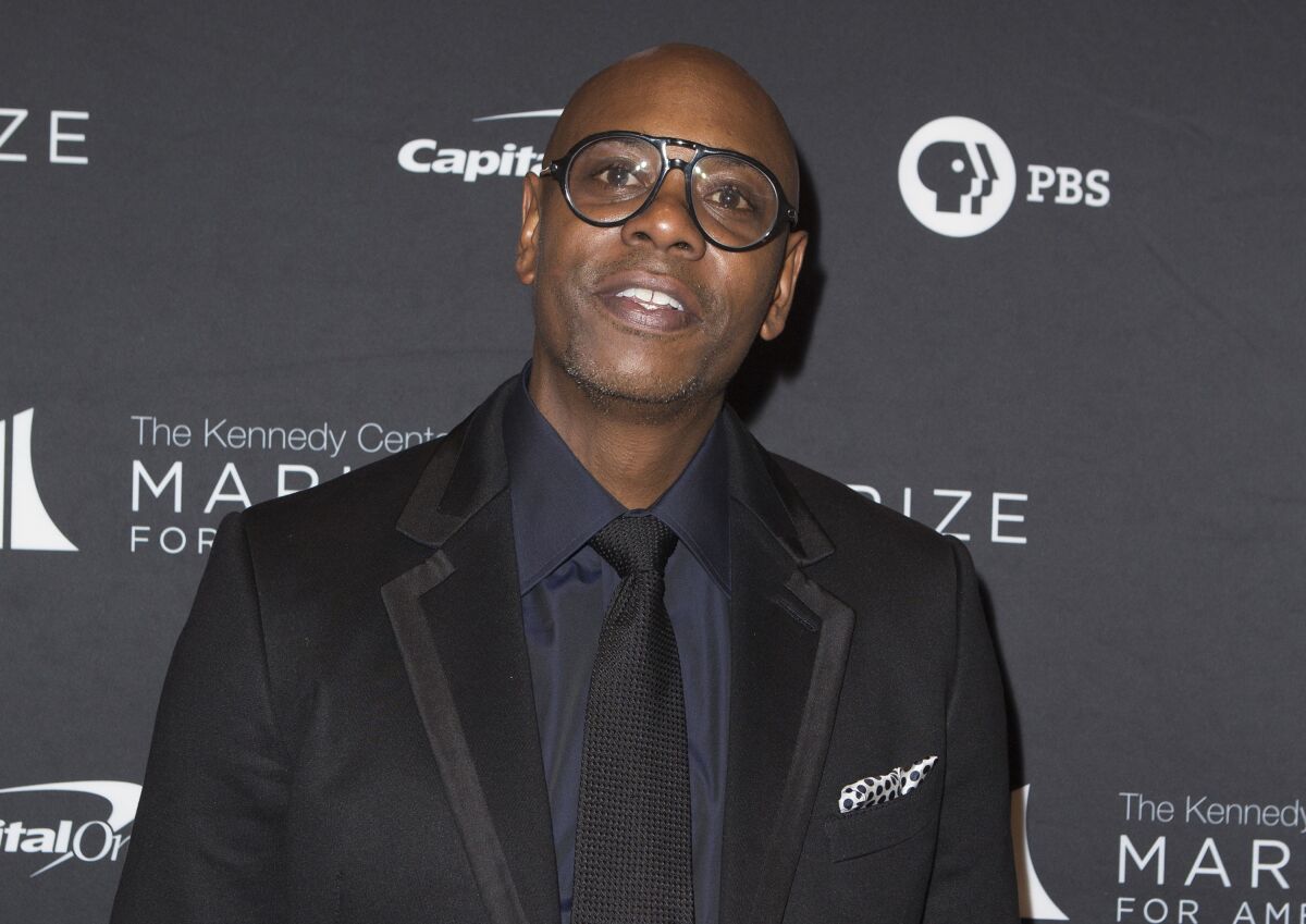 FILE - Dave Chappelle arrives at the 22nd Annual Mark Twain Prize for American Humor on Oct. 27, 2019, in Washington, D.C. A top Netflix executive said Dave Chappelle's special “The Closer” doesn't cross “the line on hate” and will remain on the streaming service despite fallout over the comedian's remarks about the trans community. (Photo by Owen Sweeney/Invision/AP, File)