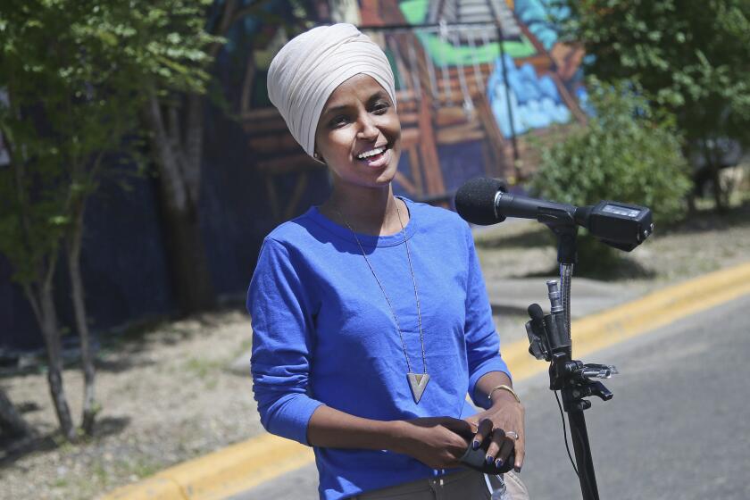 Rep. Ilhan Omar fields media questions in Minneapolis on Tuesday.