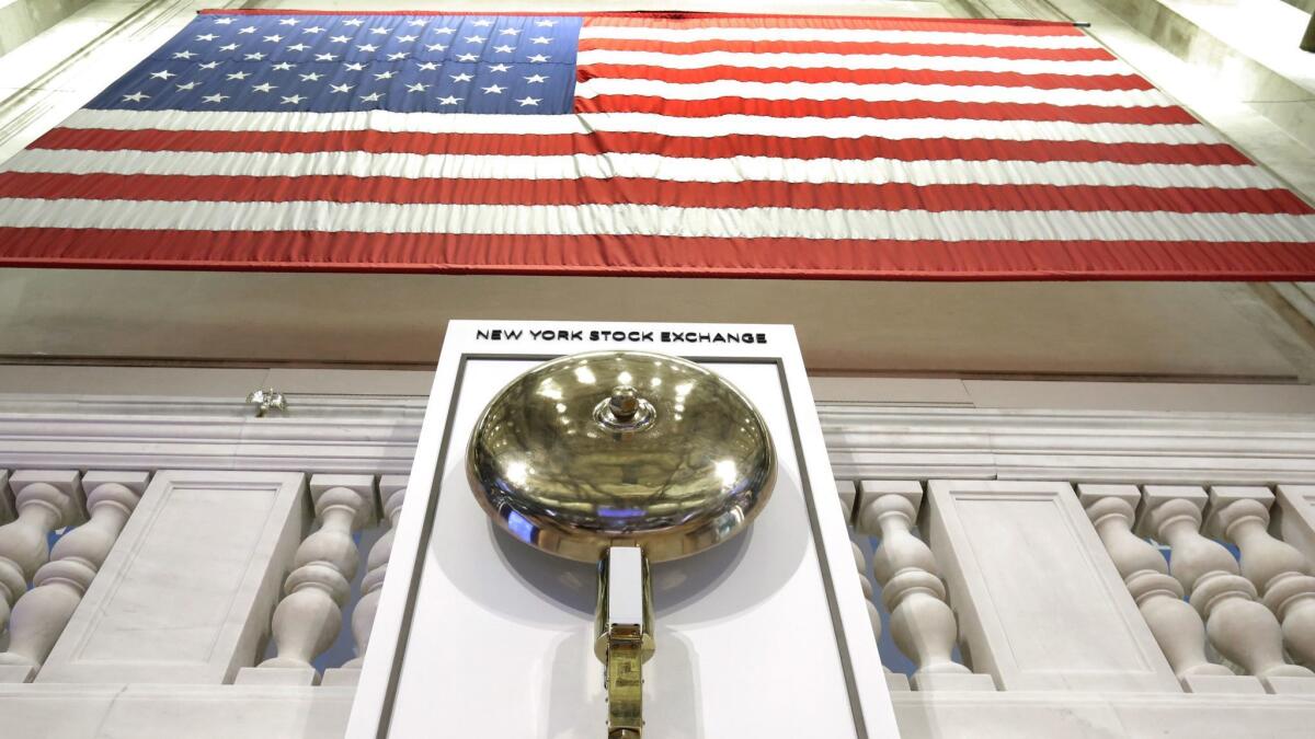 An American flag hangs above the bell podium at the New York Stock Exchange.
