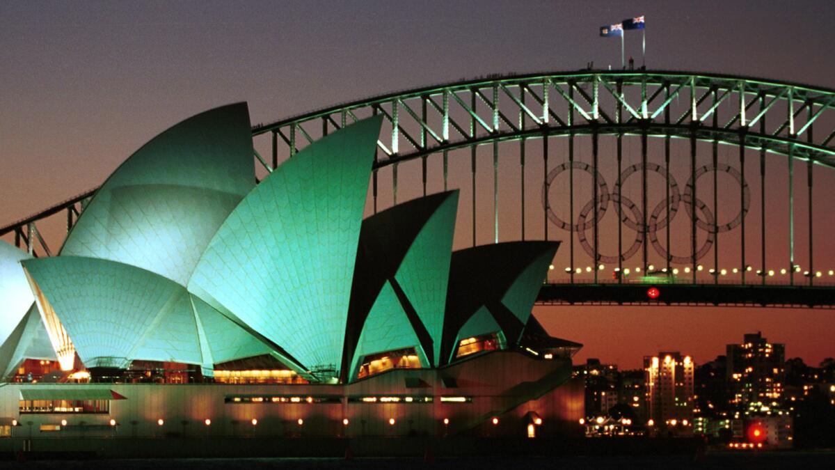 Olympic rings adorn Australia's Sydney Harbor Bridge next to the Sydney Opera House before the start of the Summer Olympics in September 2000.