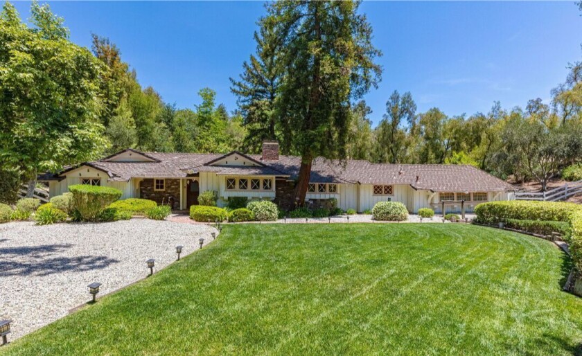 The smaller home sits on two acres surrounded by citrus and sycamore trees.