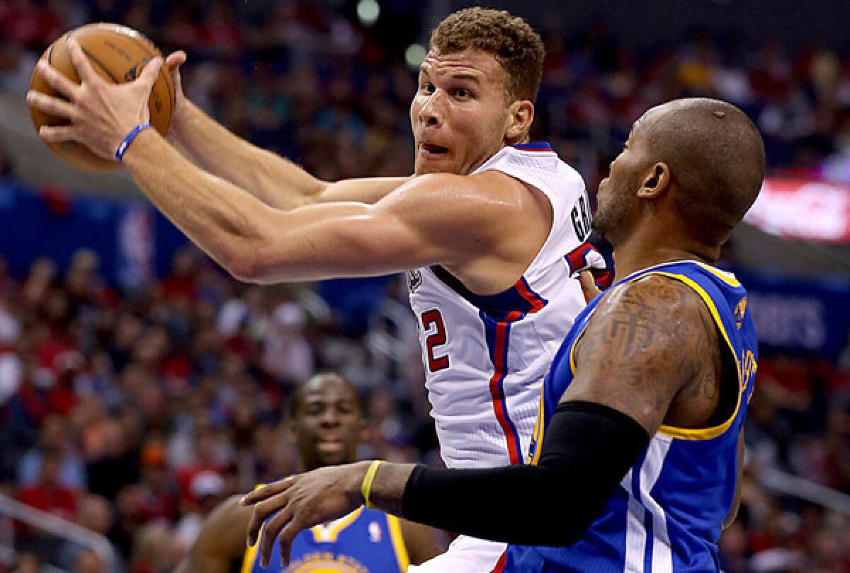 Clippers power forward Blake Griffin drives to the basket against Warriors forward Marreese Speights during a game this season at Staples Center.