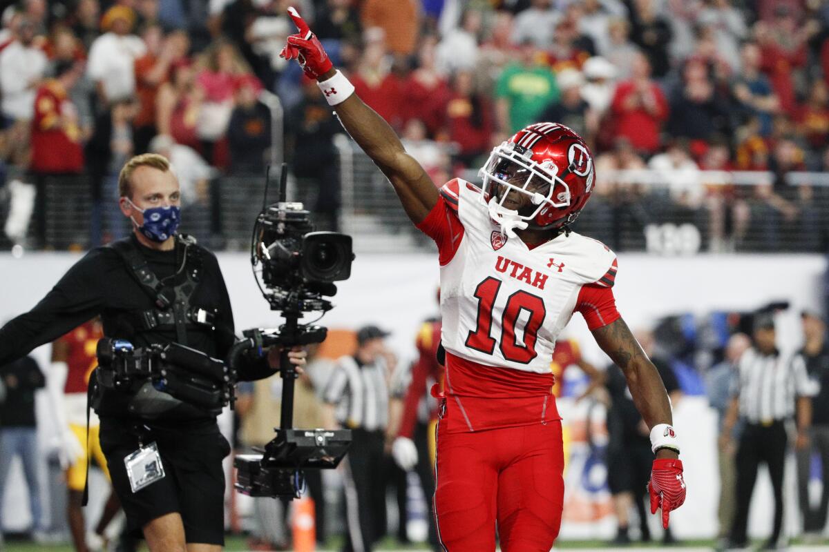 Utah receiver Money Parks celebrates after scoring a touchdown during the third quarter of the Pac-12 championship game 