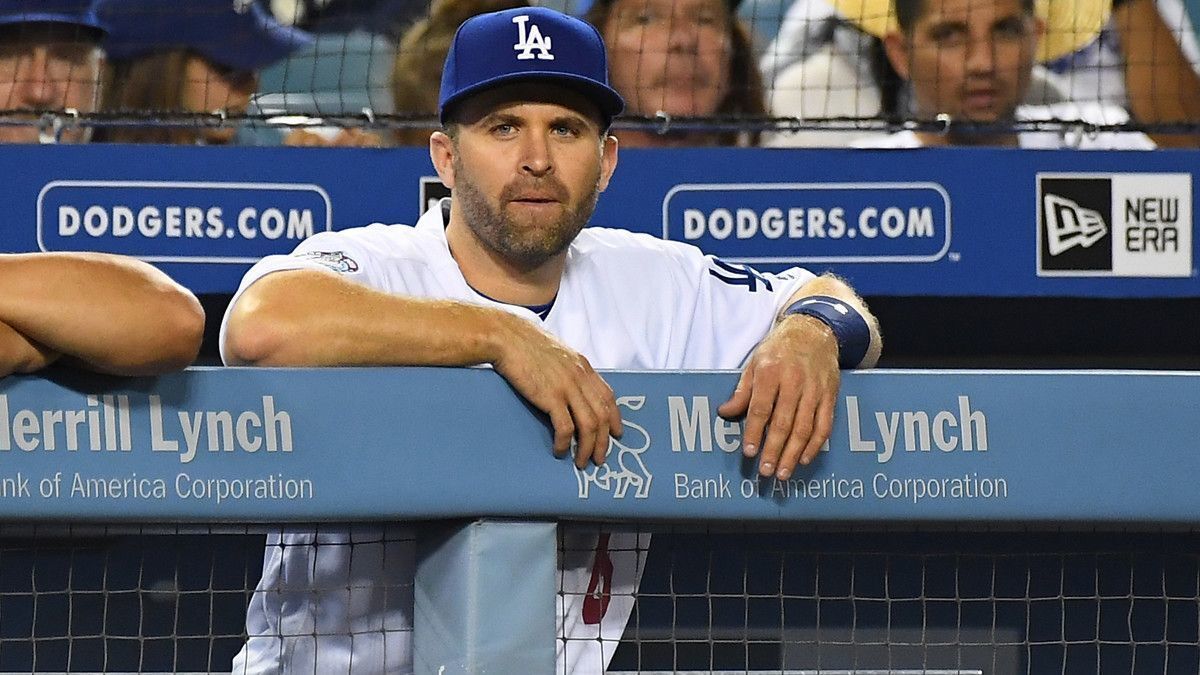 Newly acquired Dodger second baseman Brian Dozier watches the ninth inning of the game against the Milwaukee Brewers from the dugout at Dodger Stadium on Tuesday.