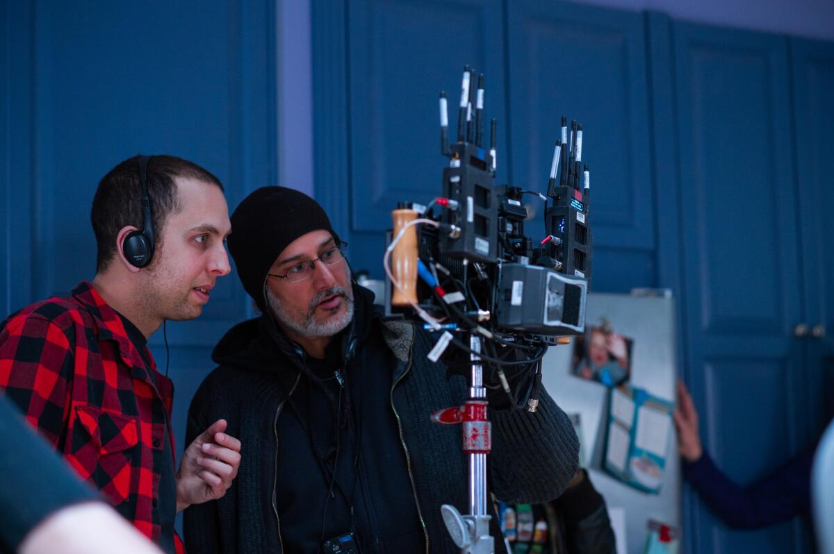 Director Brandon Cronenberg, left, and director of photography Karim Hussain on the set of "Possessor."