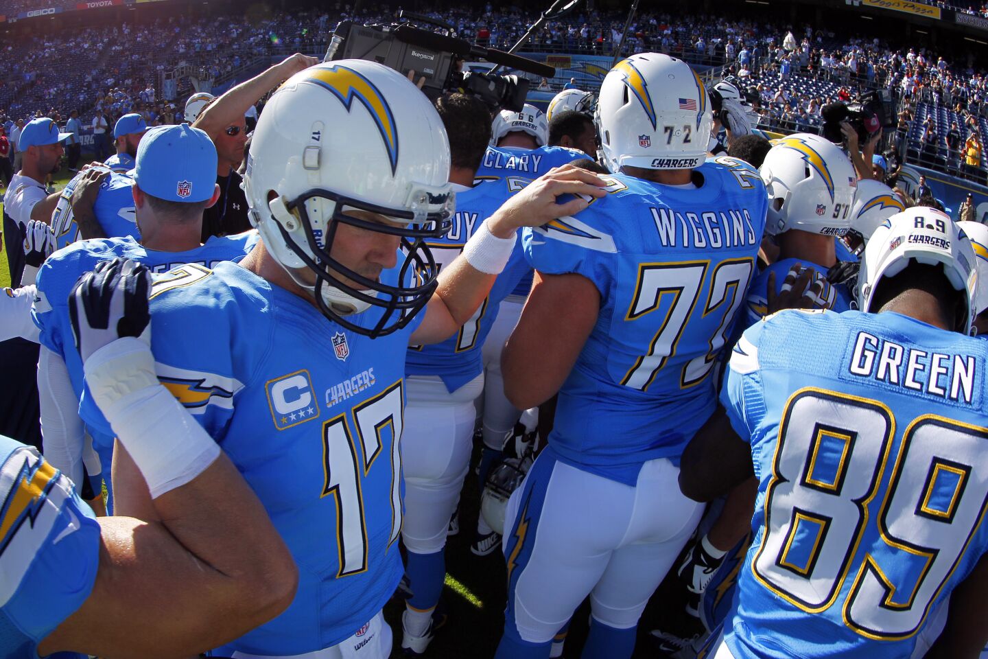 Chargers quarterback Philip Rivers gathers with his team before a game against the Cincinnati Bengals at Qualcomm Stadium on Dec. 1, 2013