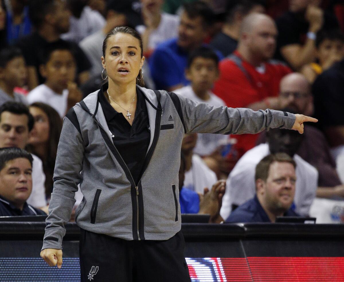 Becky Hammon coaches the San Antonio Spurs during the first half of an NBA summer league basketball game against the Boston Celtics on July 18.