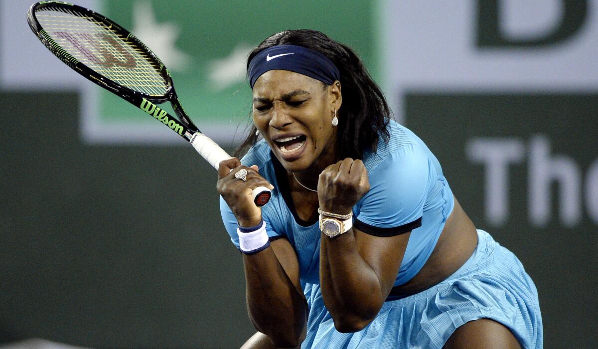 Serena Williams reacts after breaking the serve of Agnieszka Radwanska during the second set tiebreaker on Friday.