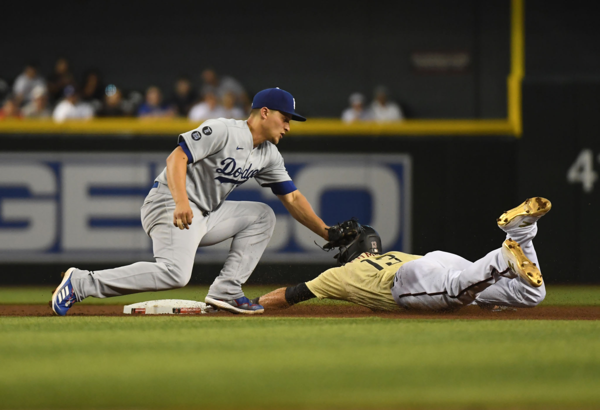 The Diamondbacks' Nick Ahmed steals second base ahead of Dodgers shortstop Corey Seager's tag in the fourth inning.