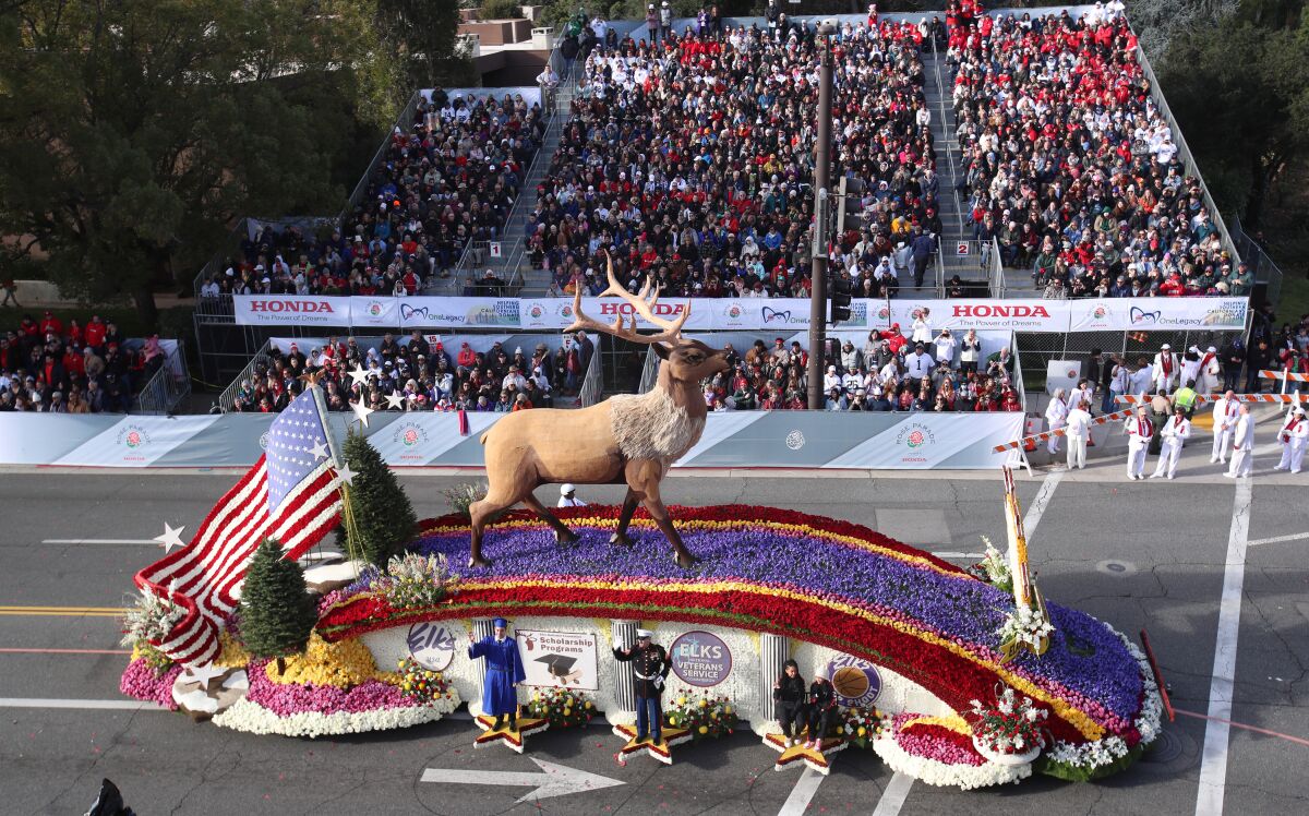 Thousands of parade-goers watch The Elks U.S.A. "Investing In Our Communities" float.
