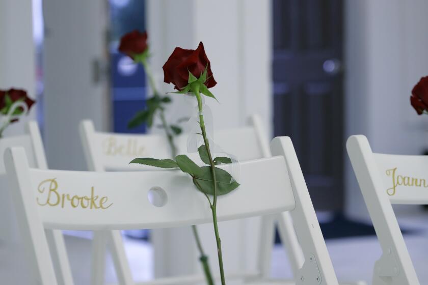 FILE - In this Nov. 12, 2017 file photo, a memorial for the victims of the shooting at Sutherland Springs Baptist Church includes 26 white chairs, each painted with a cross and and rose and placed in the sanctuary, in Sutherland Springs, Texas. A federal judge ruled Wednesday, July 7, 2021, the U.S. Air Force was "60% responsible" for the attack at First Baptist Church in Sutherland Springs because it failed to submit Devin Kelley's criminal history into a database, which should have prevented the gunman from purchasing the weapon used in the attack. (AP Photo/Eric Gay, File)