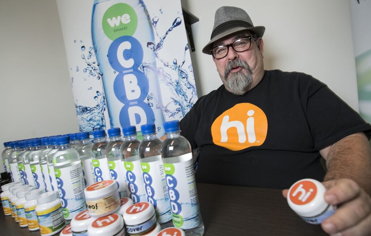 Hal Lewis, national sales director for Cannabis Sativa Inc., with Hi-brand cannabis balm and other products.