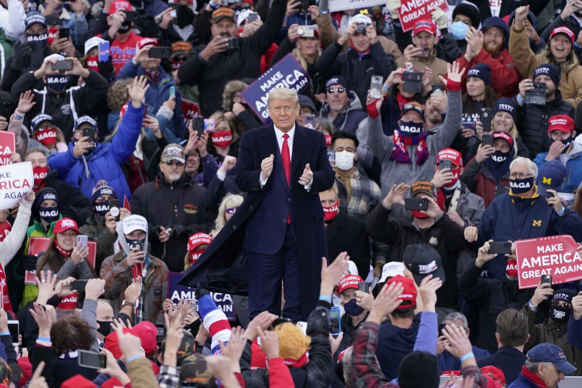 President Donald Trump arrives at a campaign rally, Saturday, Oct. 17, 2020, in Norton Shores, Mich. (AP Photo/Carlos Osorio)