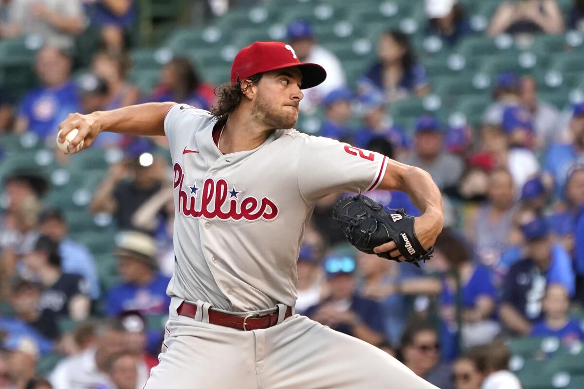Philadelphia Phillies starting pitcher Aaron Nola delivers during the first inning of a baseball game against the Chicago Cubs Tuesday, July 6, 2021, in Chicago. (AP Photo/Charles Rex Arbogast)
