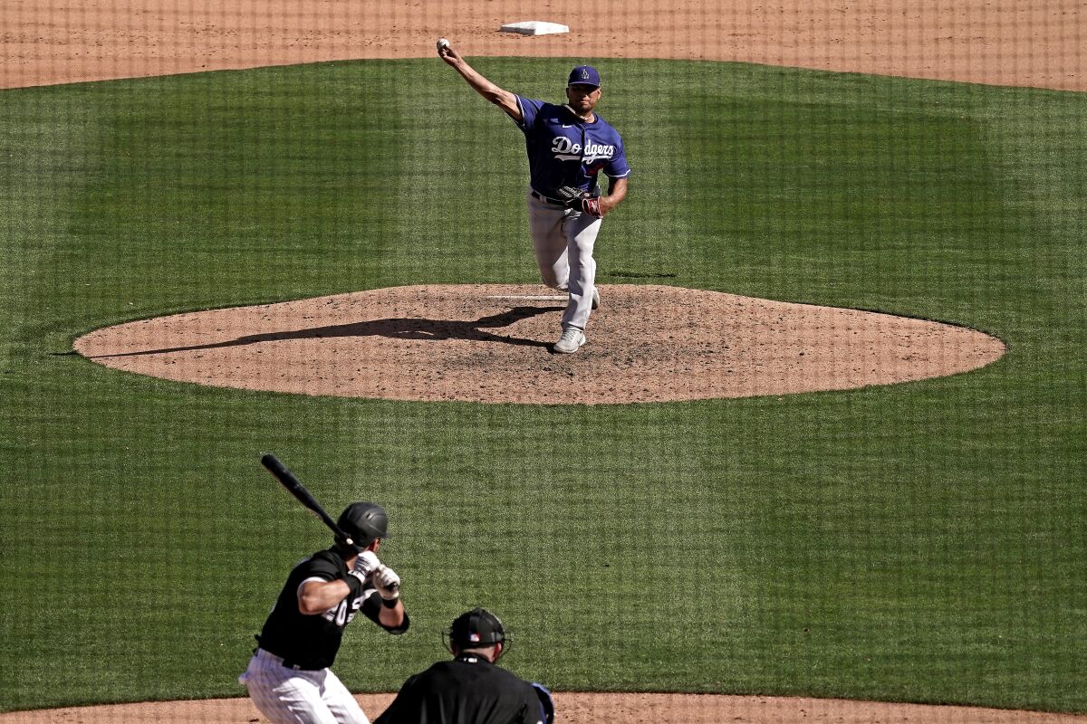 Dodgers reliever Brusdar Graterol delivers to Chicago White Sox batter Danny Mendick during a spring training game.