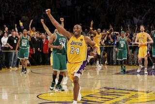 Kobe Bryant begins the celebration as the Lakers beat the Celtics for the NBA Championship at Staples Center.