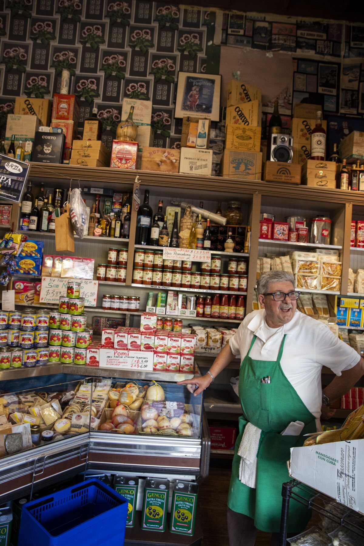 Franco Crivello stands ready to help customers at Molinari Delicatessen.