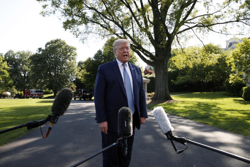 President Donald Trump speaks with reporters as he departs the White House on Marine One, Friday, May 15, 2020, in Washington. Trump is en route to Camp David, Md. (AP Photo/Alex Brandon)