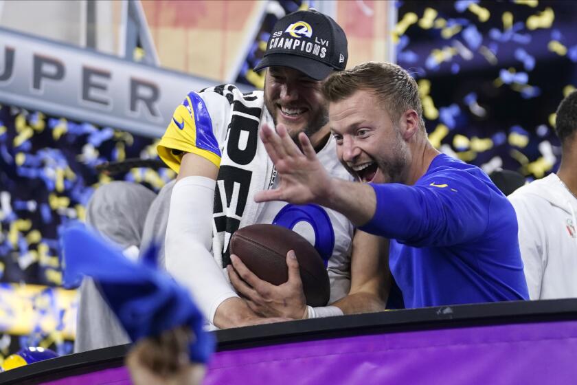 Los Angeles Rams quarterback Matthew Stafford, left, and head coach Sean McVay celebrate after the Rams defeated the Cincinnati Bengals in the NFL Super Bowl 56 football game Sunday, Feb. 13, 2022, in Inglewood, Calif. (AP Photo/Marcio Jose Sanchez)