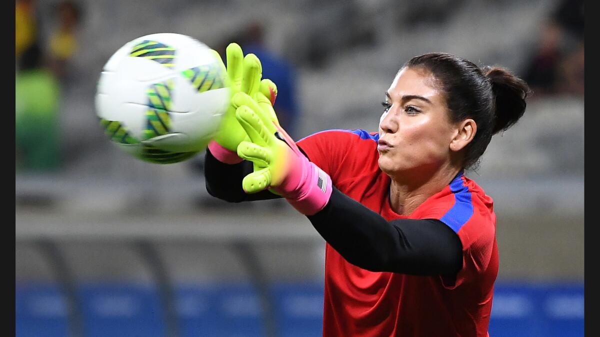 Goalie Hope Solo warms up before the U.S. team's opening game of the 2016 Olympics against New Zealand in Belo Horizonte, Brazil. The U.S. won, 2-0.
