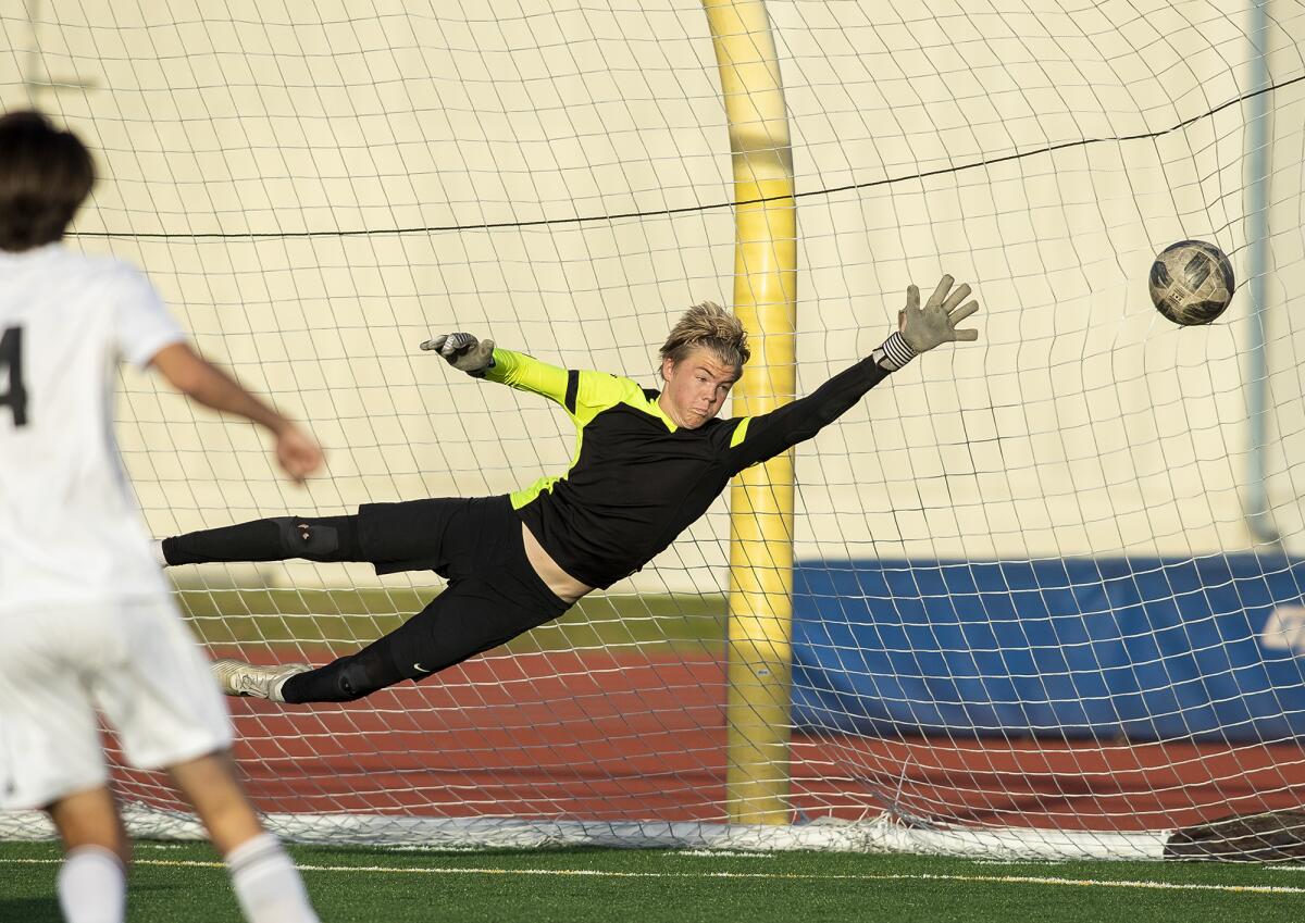 Fountain Valley goalkeeper Jack Nelson fails to block Huntington Beach's Josh Lucas' shot in the 64th minute of a Wave League match on Wednesday.