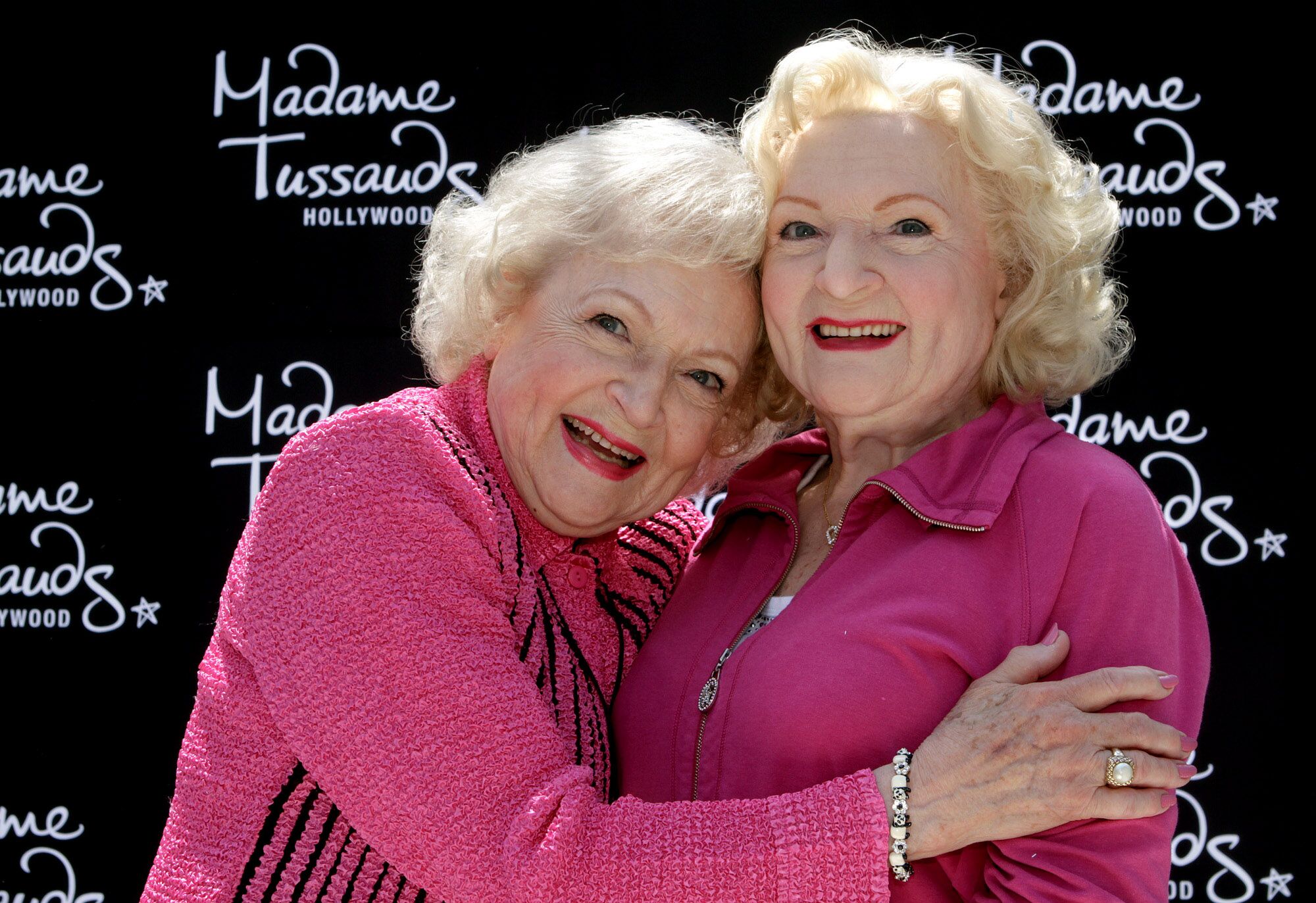 Actress Betty White poses next to a wax figure in her likeness at Madame Tussauds in Hollywood.