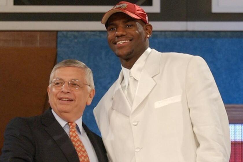 LeBron James shakes hands with NBA commissioner David Stern after being selected No. 1 overall by the Cleveland Cavaliers in the 2003 NBA Draft.