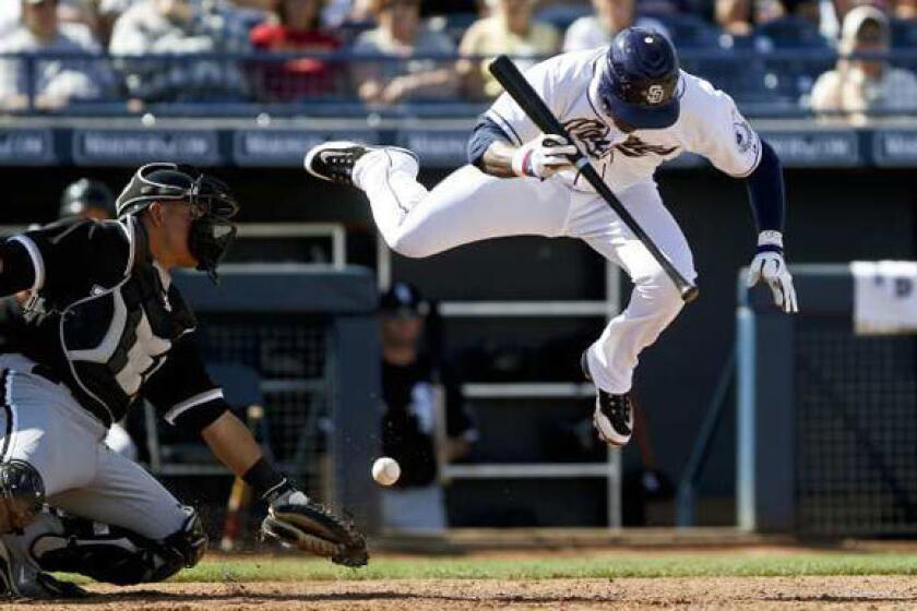 Orlando Hudson evades a ball while batting for the Padres in spring training this year.