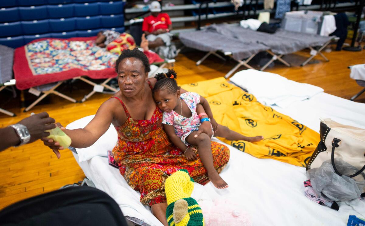 Teresa Okoma Wayemala with her daughter, Melissa, 2, from Congo