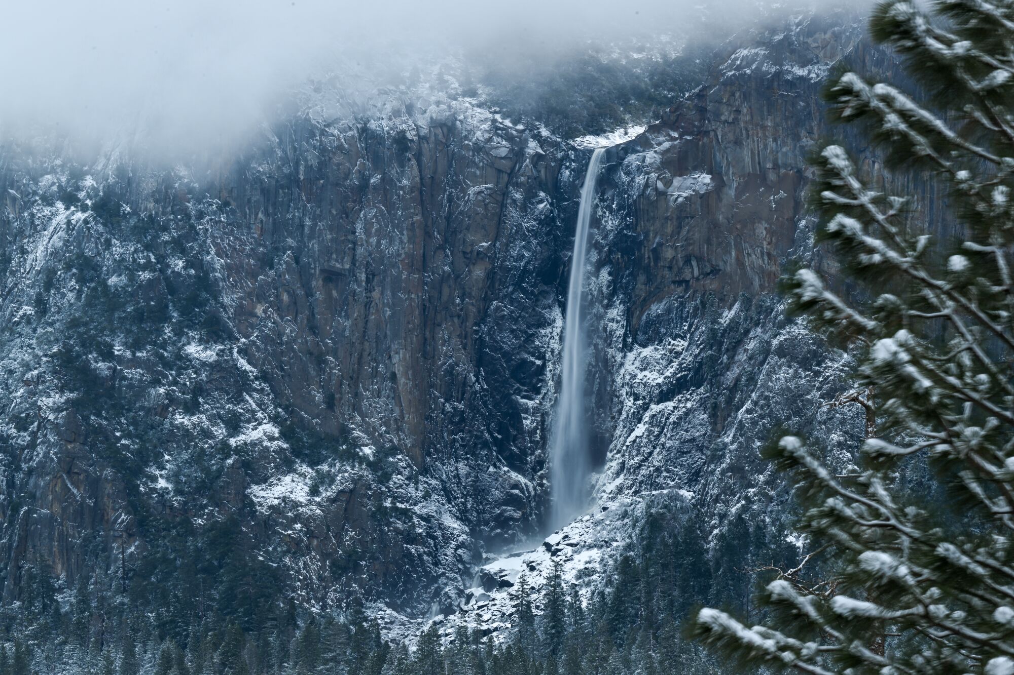A view of Yosemite falls as snow blanked Yosemite National Park.