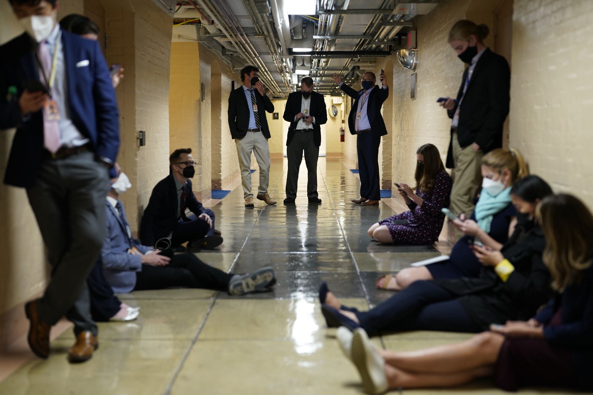 Stand and sit in a hallway